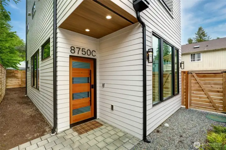 Private Secure Entry with front, side and rear yard space!