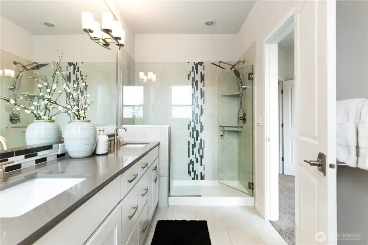 Beautiful tile work and sleek countertops.