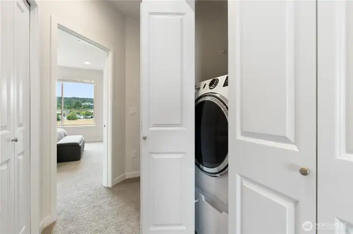 Washer and dryer conveniently located on upper level.