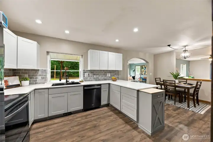 Beautifully updated with quartz counters, stainless steel appliances, & plenty of space for hosting