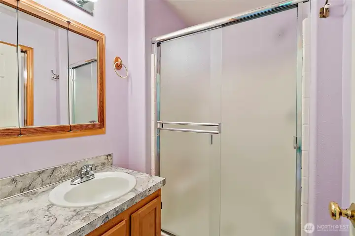 3/4 bathroom on upper level next to secondary bedrooms.