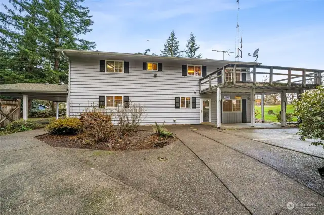 lots of back yard patio space with sidewalks to outbuildings