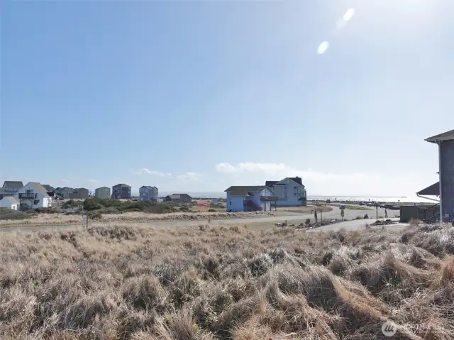 View of the lot (taken from the middle of the lot, and looking Southeast towards the street and Jetty).