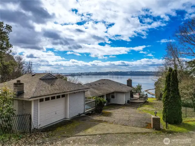 Upper portion of circular driveway, oversized 1-car garage.