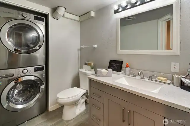 Lower level 1/2 bath with washer/dryer.
