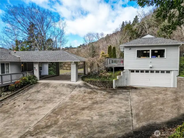 Lower portion of circular driveway, 2-car garage and lots of off-street parking.