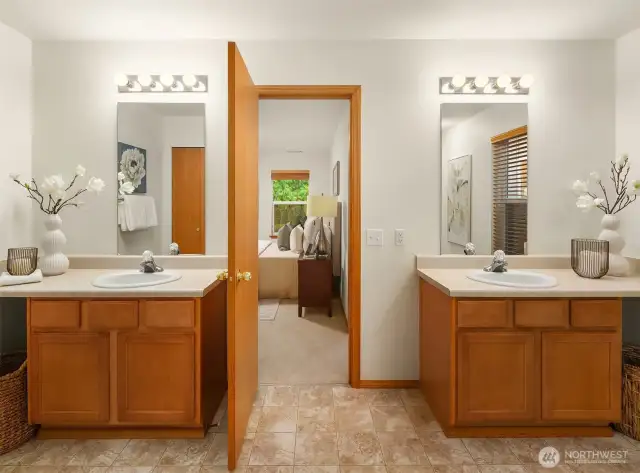 Second Primary Suite attached Bathroom with double vanities provide ample storage and space.