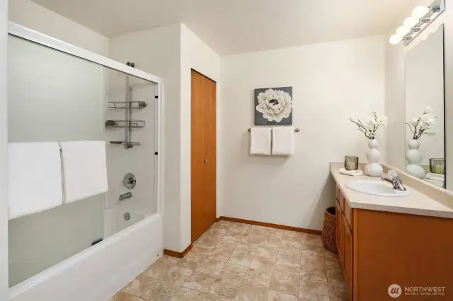 Shower Tub combo and large linen closet.