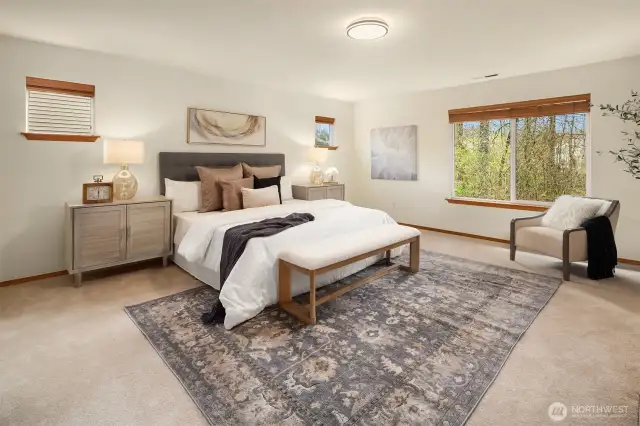 Gorgeous upstairs Primary Suite feels like a peaceful retreat with room for a King Bed, sitting area and additional storage furniture.