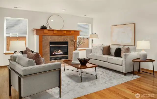 Light & bright Living Room with cozy gas Fireplace.