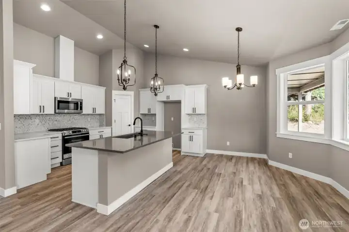 Spacious Kitchen with Storage Pantry, Quartz Counters, & SS Appliances