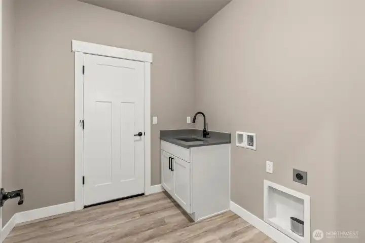 Laundry Room with Sink and Garage Access