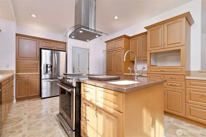 This is really a beautiful kitchen - top end stainless appliances, tons of storage, pull-outs and all kinds of amenities here. Solid surface (Corian) counters.