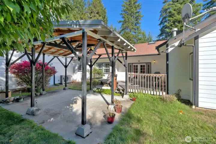 Really nice back deck leading to a covered outdoor living space.