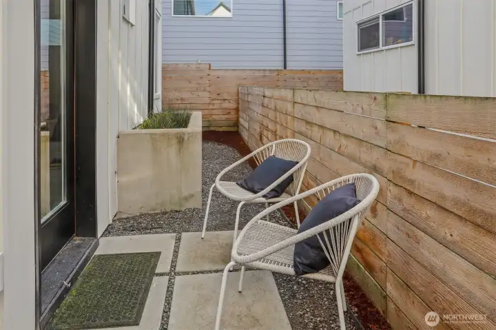The fenced outdoor area provides options for pet and a place to enjoy the fresh air.