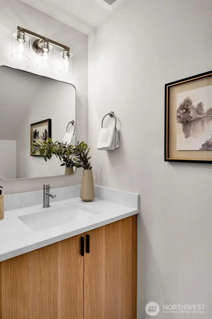 A convenient powder room under the stairs,