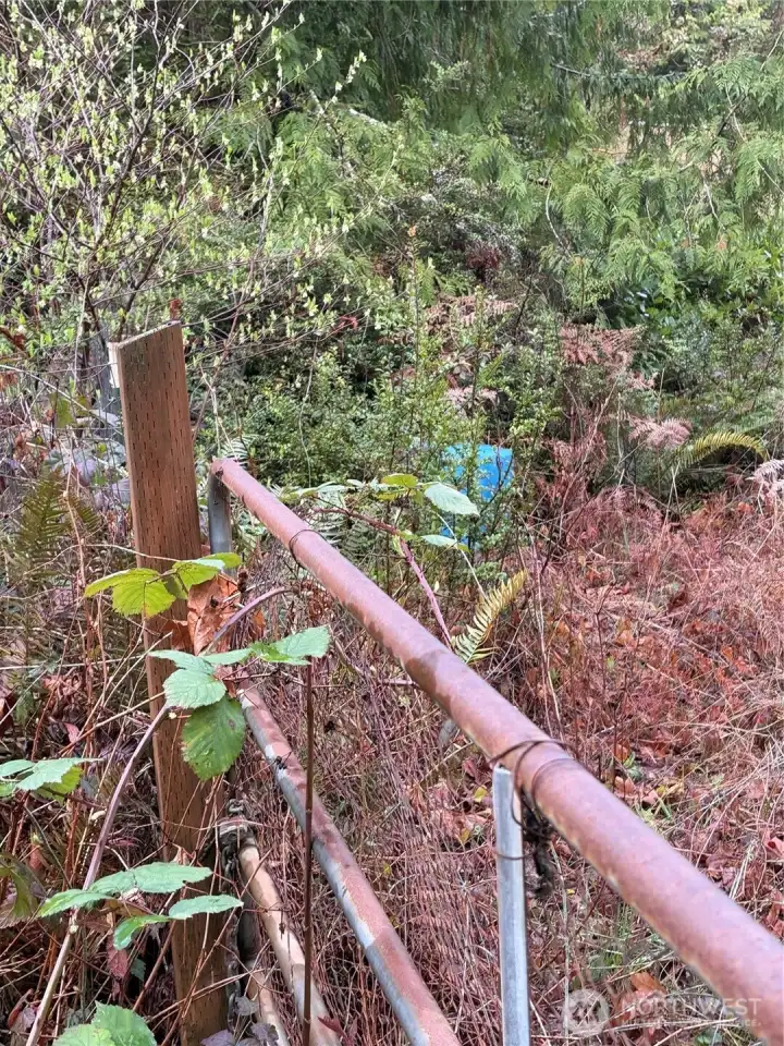 Well on adjoining property with shared well agreement and waterline easement recorded.