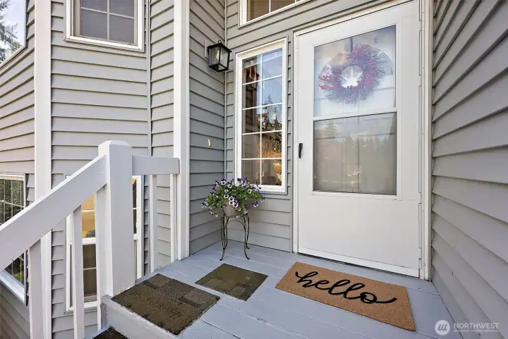 Entry into house at top of front porch stairs