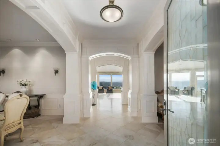 Timeless interior finishes including Italian travertine flooring and soaring 10' ceilings.