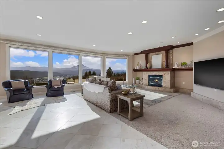 Expansive great room with statement fireplace and breathtaking views