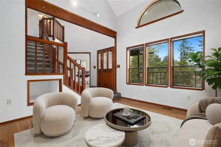 Spacious living rm looking towards stairway and den