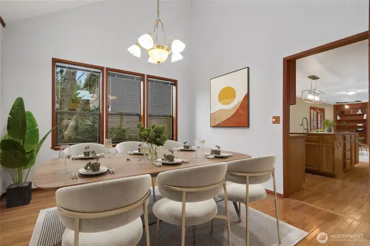 Spacious dining rm with chandelier, new wall paint and hardwood floors. Ez access to kitchen for entertaining.