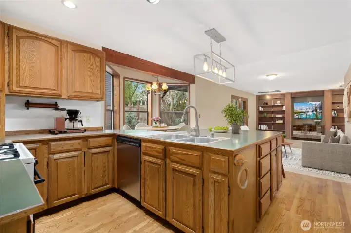 Huge island type counterop in kitchen , hardwood floors