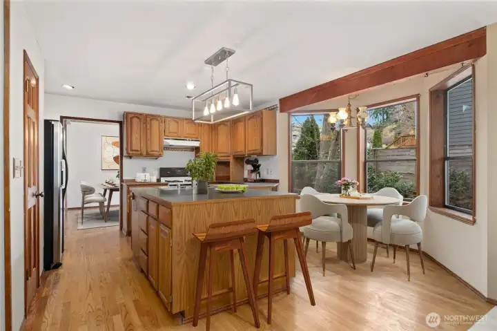 Eating nook with bay windows, also a short breakfast bar