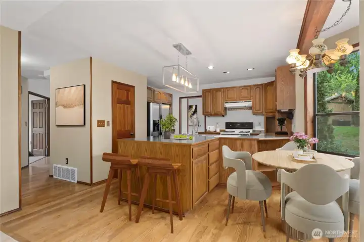 Spacious kitchen, pantry on left side of photo, eating nook on right