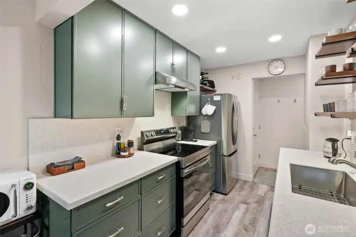 New cabinets, new solid surface contertops that extends to backsplash and all new applances.