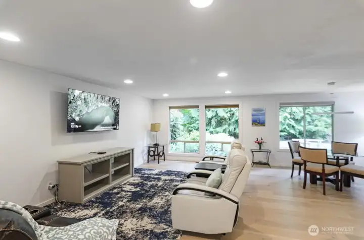 This home feels light and bright with updated lighting throughout.  Open living and dining room plus kitchen.