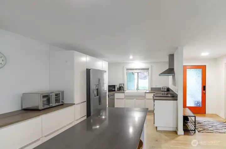 Kitchen has loads of modern cabinetry, plus upgraded stainless appliances.  New dishwasher and induction stove recently installed.
