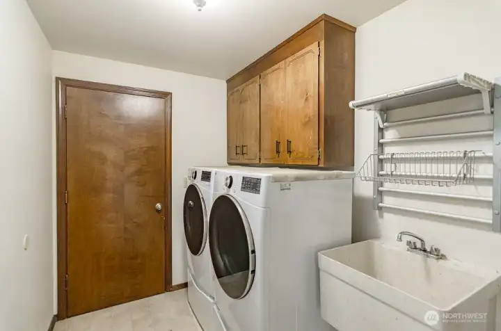 Utility room is off the family room and door leads to garage.