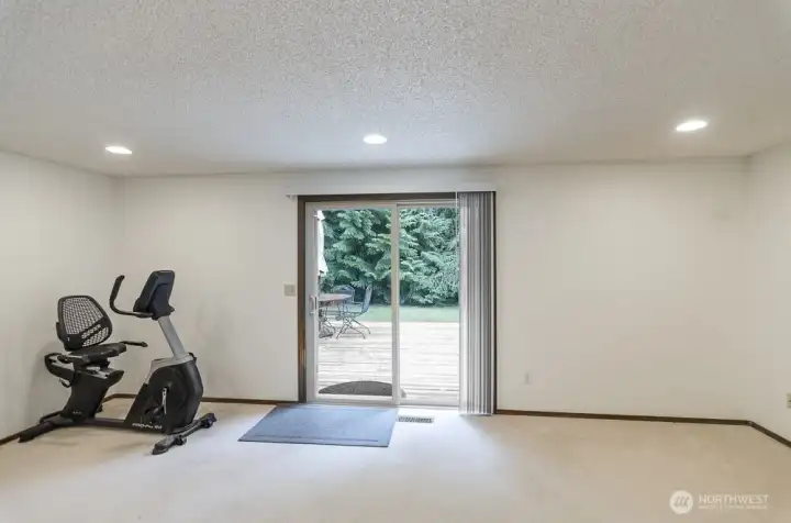 Family room has slider leading to expended desk.