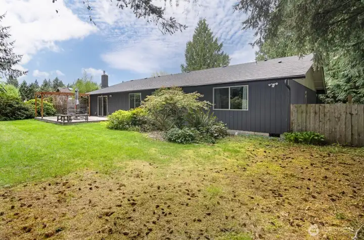 Side yard is wide  on this side.  Home also has a new energy efficient electric heat pump water heater.