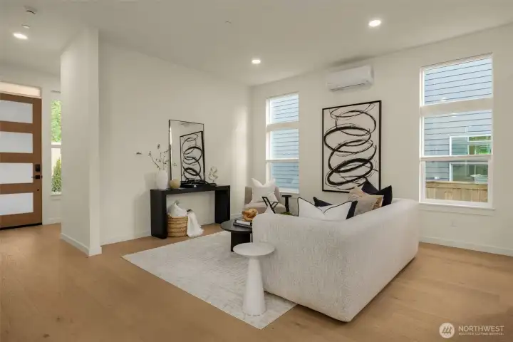 Open concept living. Main level has soaring 10-foot ceilings and wide-plank hardwood floors.