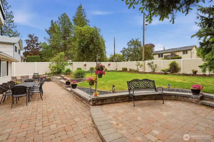 Fenced backyard with brick patio Fenced backyard with brick patio