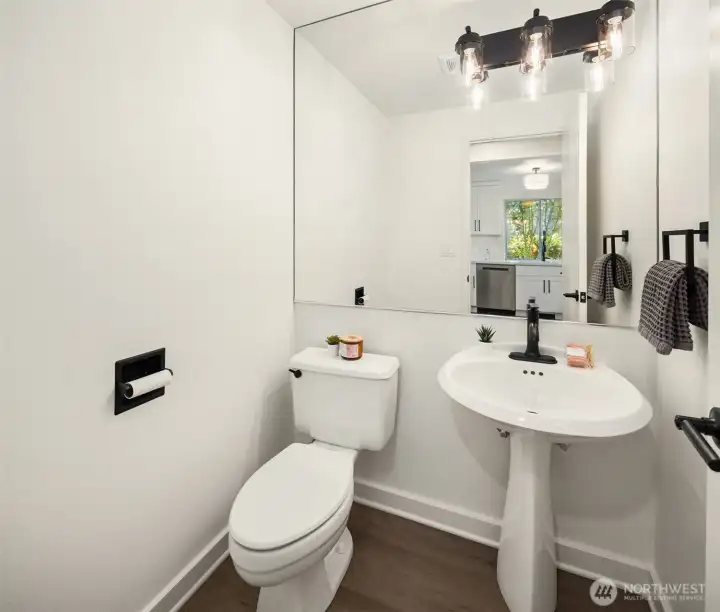 Updated half bath with stylish finishes.