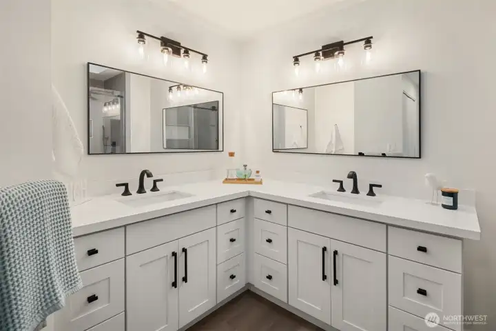 Primary bath with dual vanities.