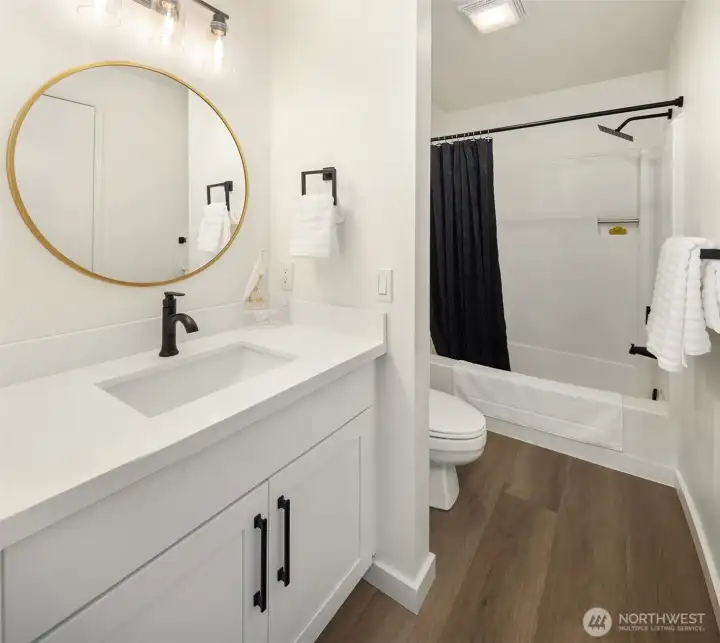 Shared bath with a tub/shower combo.