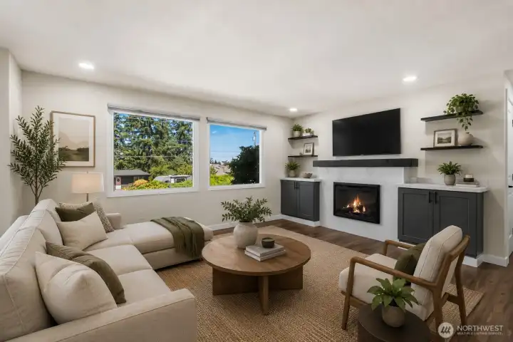 Living room virtually staged to showcase feature TV wall. Hardware installed for TV.