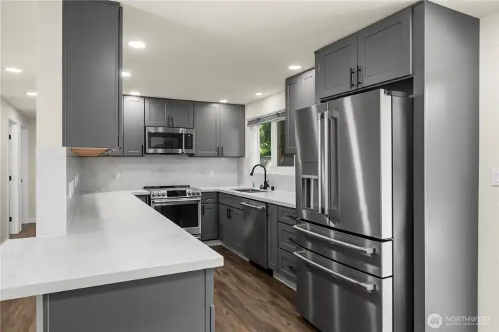 The kitchen is fully remodeled with new appliances, electrical and plumbing.