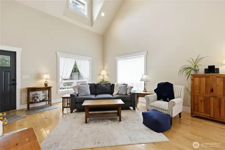 The spacious living room with vaulted ceilings