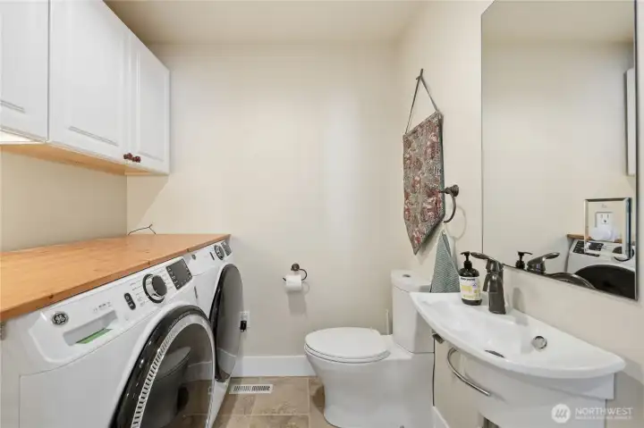 Utility room on the main floor with half bath