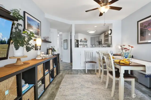 Beautifully updated...the dining area is topped with a ceiling fan & the kitchen has been opened up to enjoy the view & unite the rooms.