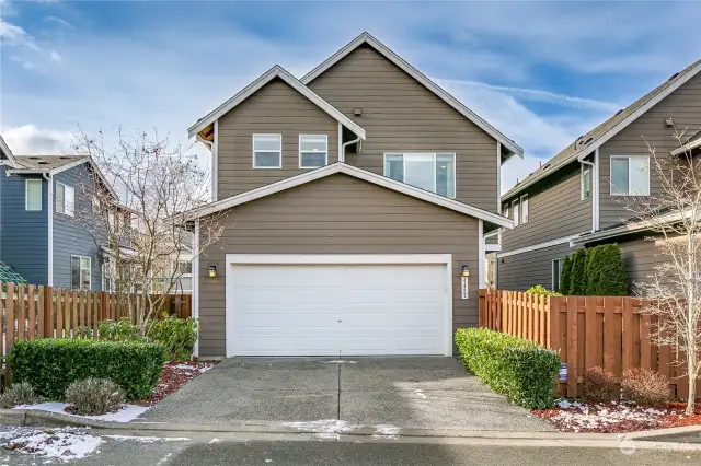 Two-car attached garage at the back side of the house.