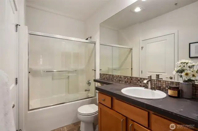 Full bathroom with double entry access.