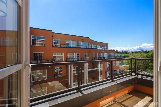 Sun-Drenched deck off of the living room, great for a bistro table & chairs.
