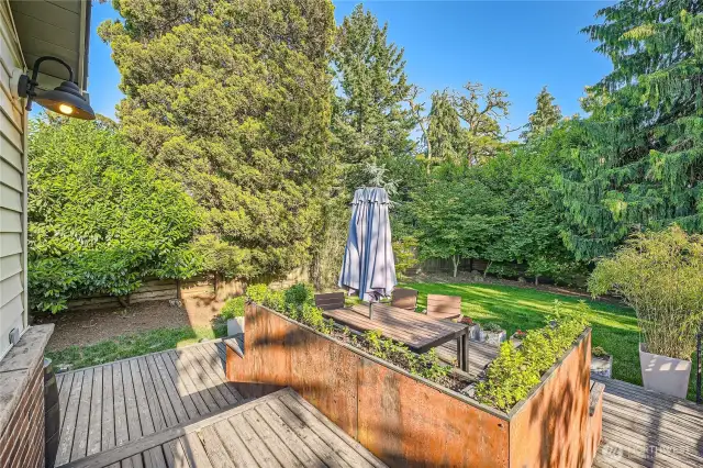 Artistic planter defines multiple spaces for your outdoor living.