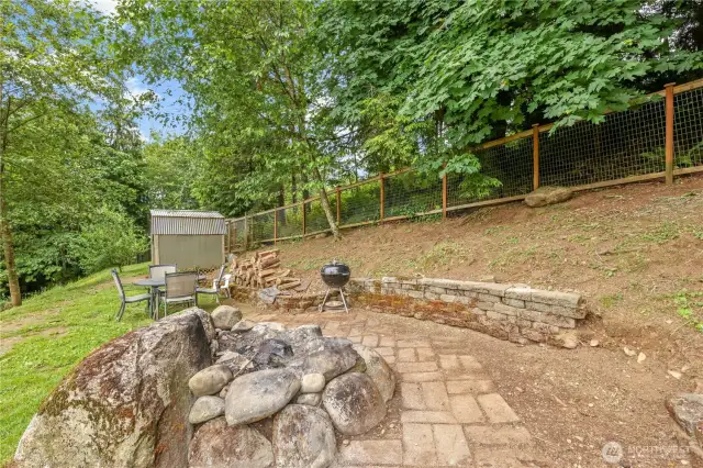 Firepit facing the foothills along with chicken coop (chickens are optional :)